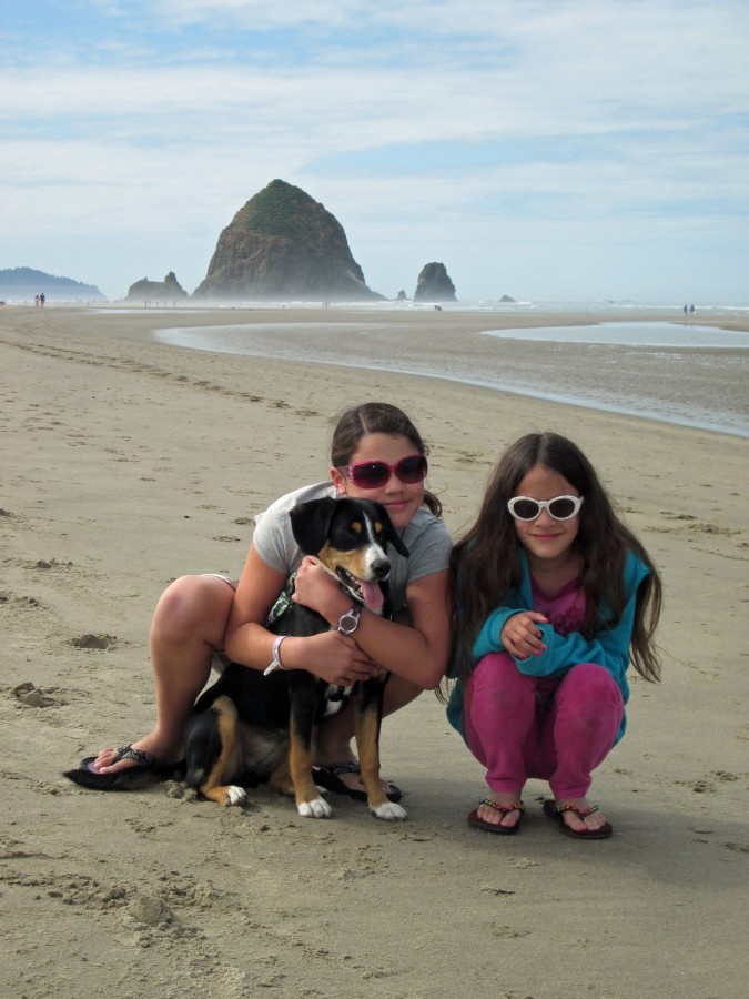 Photo of Inga and her sisters at Cannon Beach - Haystack Rock